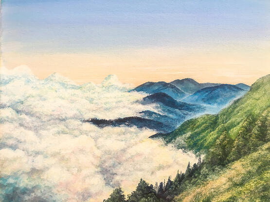 green hills descending into an ocean of clouds. the hills become more blue in tone as they fade into the distance.